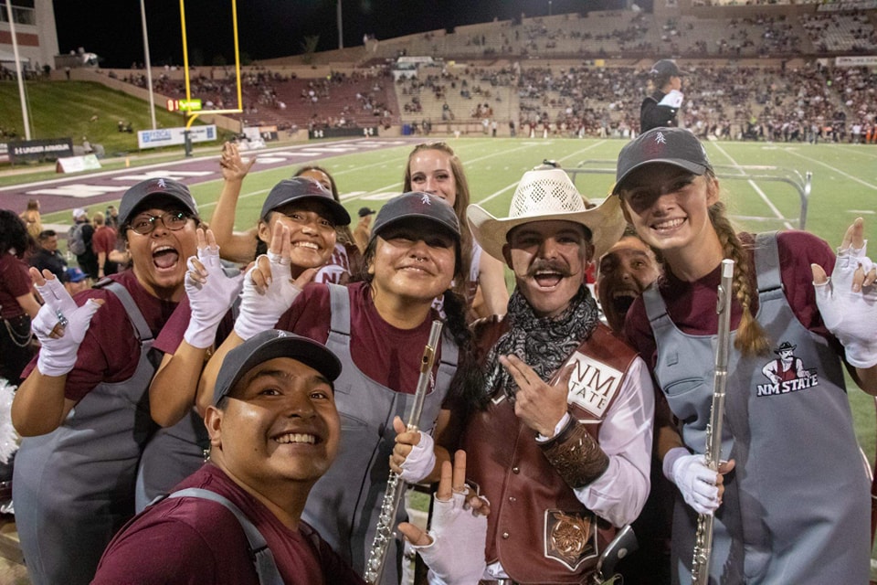 Pride of New Mexico Flutes with Pistol Pete at a NMSU Football game. 